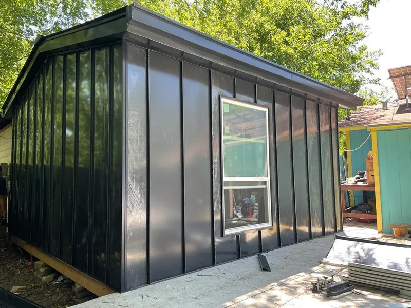 Black standing seam metal wall panels for Roof Inspection in Gilberts