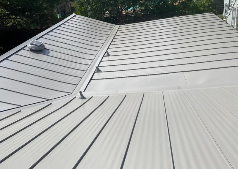 Solar attic fan installed on a metal roof for Roof Ventilation in Gilberts